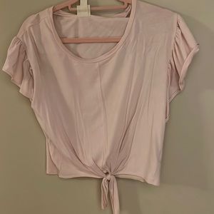 pink ruffled sleeved t that ties in the front